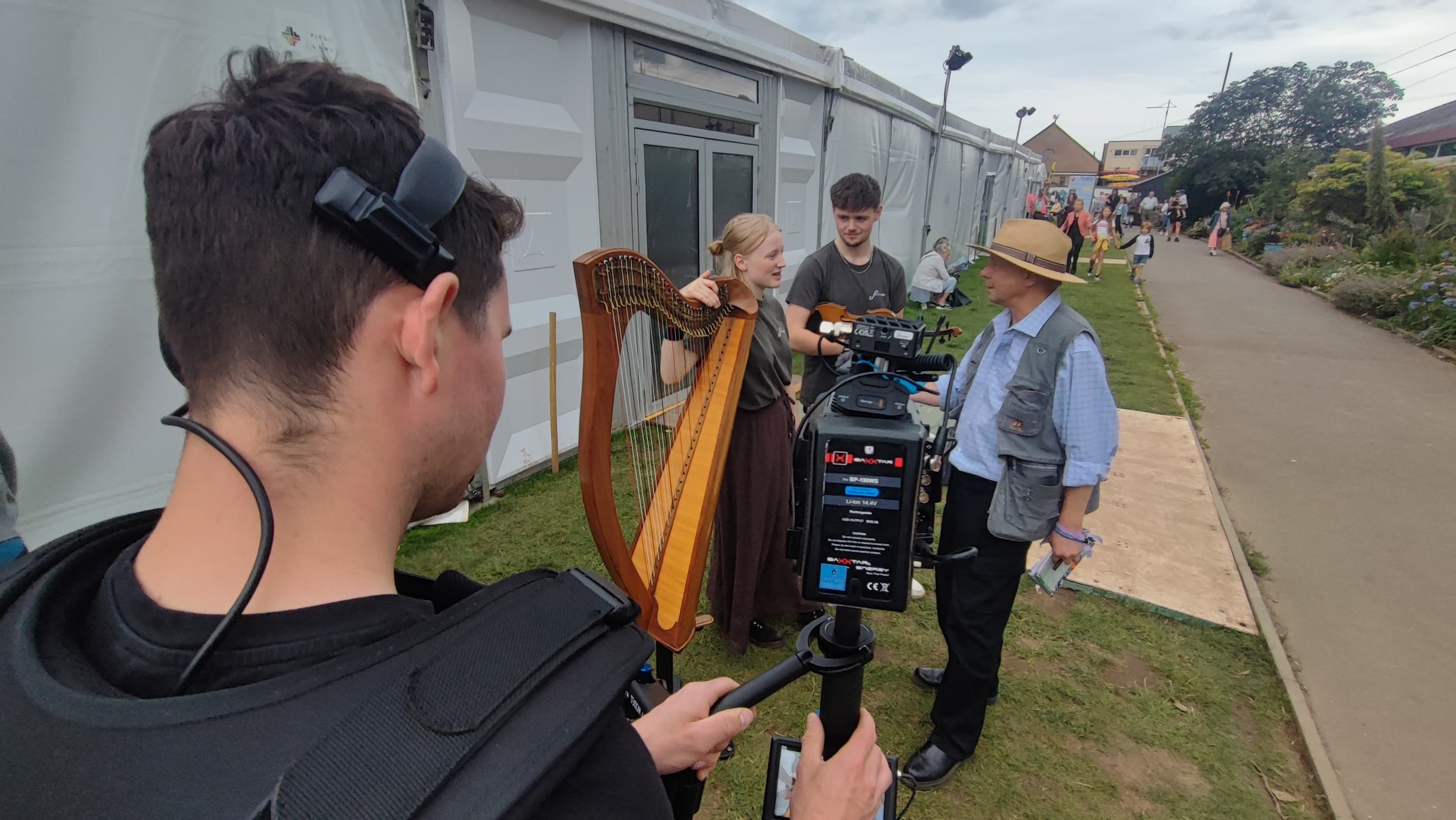 A Folkscape camera crew filming artists at a folk festival